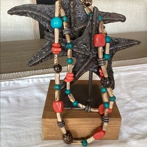 Turquoise, coral, and natural dried seed or wooden beads.